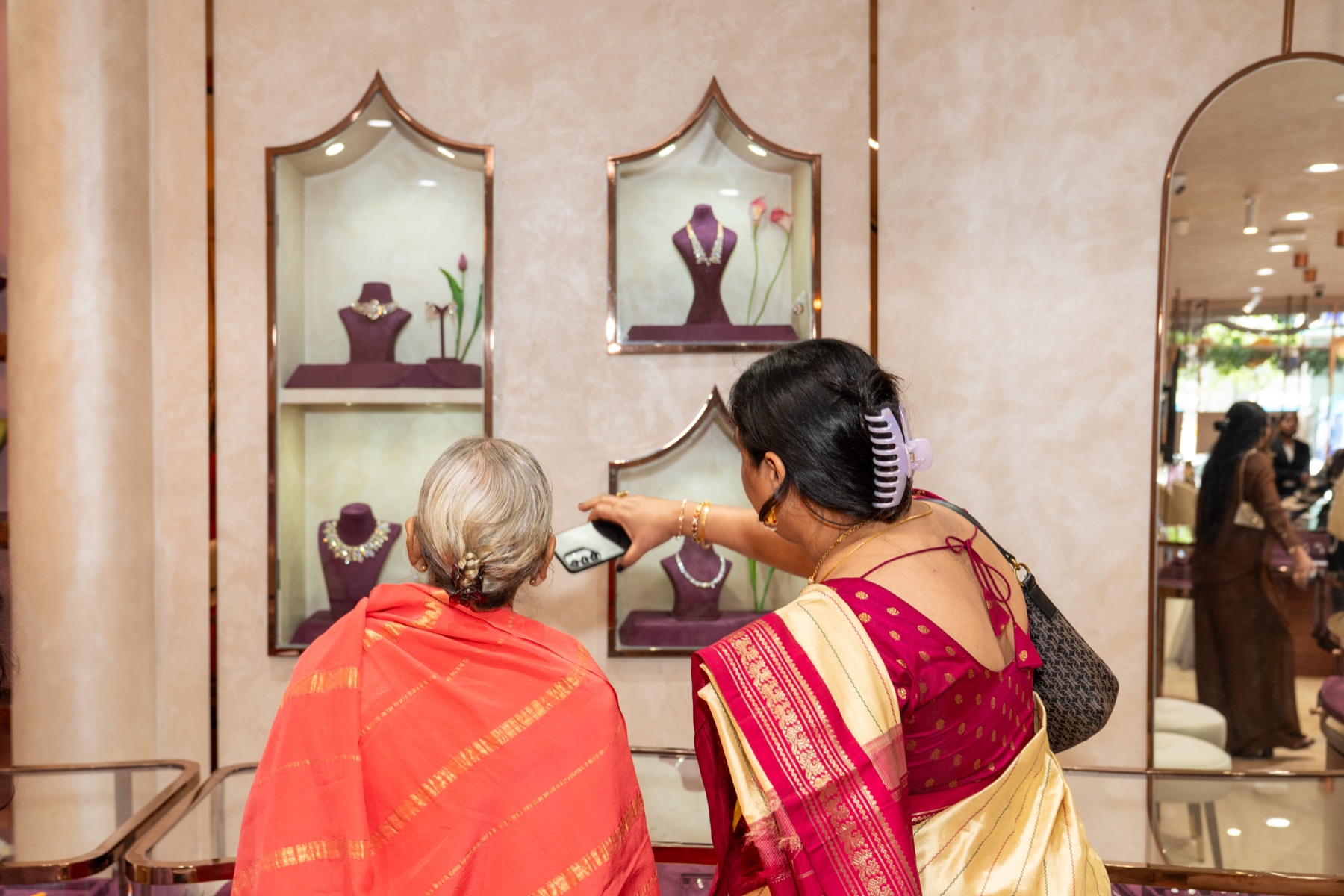 Visitors looking into the KAHA display cases